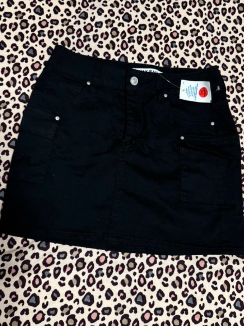 Wax Jean Black Mini Skirt with Front Pocket Details